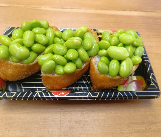 platter with edamame topped sushi
